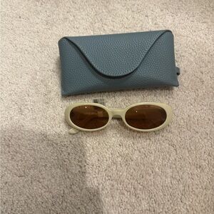 Elegant Cream Sunglasses with Blue Case